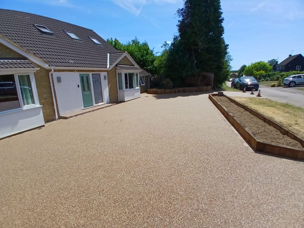 The finished resin-bound driveway with new sleeper walls in Knebworth